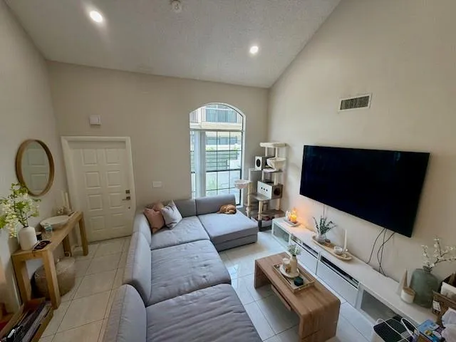 a living room with furniture and a flat screen tv