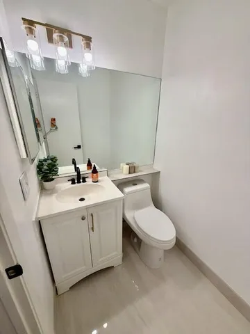 a bathroom with a sink and mirror