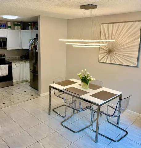 a view of a workspace with furniture