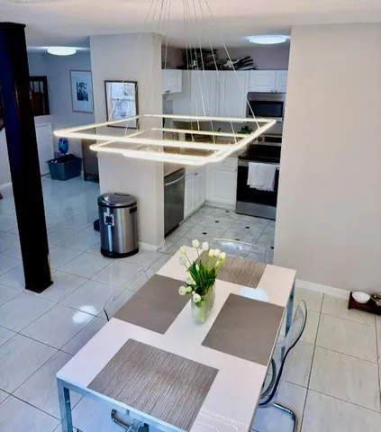 a kitchen with a sink and a stove top oven