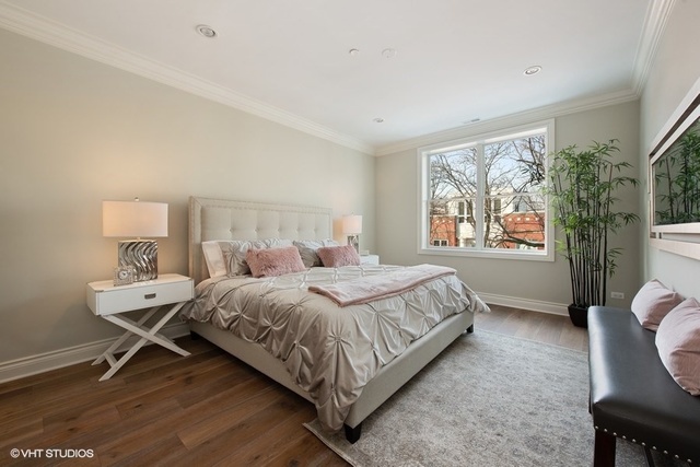 507 West Menomonee Street Chicago, IL 60614 - Photo 11 of 18 a bedroom with a bed a lamp and a window