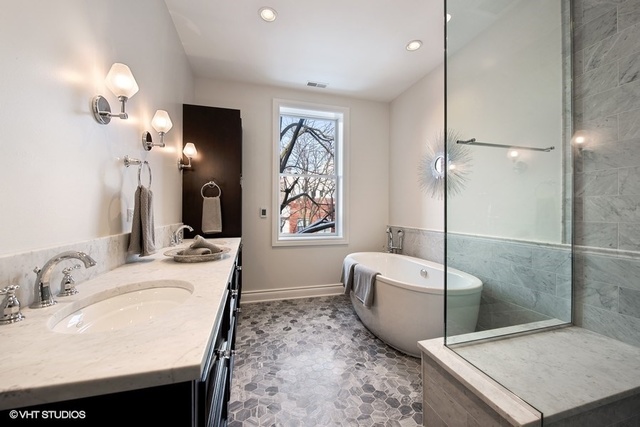 507 West Menomonee Street Chicago, IL 60614 - Photo 12 of 18 a spacious bathroom with a tub sink and mirror