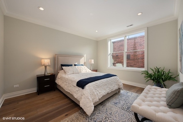 507 West Menomonee Street Chicago, IL 60614 - Photo 13 of 18 a bedroom with a bed and window