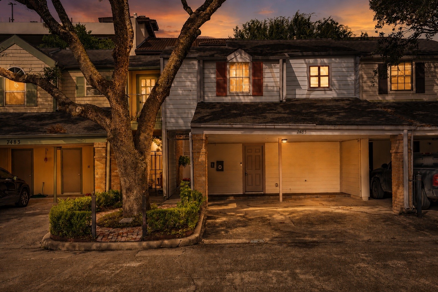 7485 Brompton Street, Unit 7485 Houston, TX 77025 - Photo 1 of 43 Charming 4-bedroom, 3 bath townhome featuring a private gated entrance that creates a welcoming sense of arrival. A beautiful mature tree anchors the front landscaping, adding timeless character and curb appeal. The thoughtfully designed layout offers comfortable living spaces, while the attached covered 2-car carport provides convenient parking and protection from the elements. Enjoy the privacy and charm of this inviting home in a serene setting.