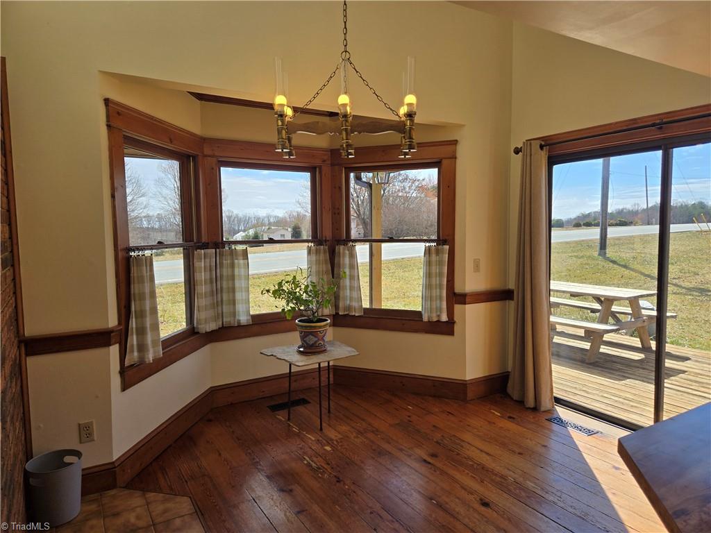 1077 Flat Shoals Road King, NC 27021 - Photo 15 of 46 A bright, sunny area with vaulted ceiling.