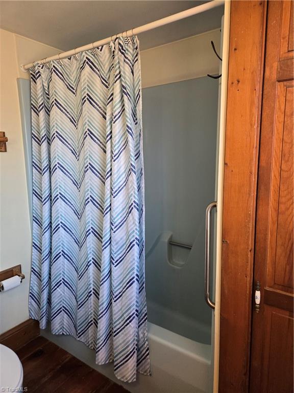 1077 Flat Shoals Road King, NC 27021 - Photo 20 of 46 Shower/ tub with grab bar. Linen closet on the right.