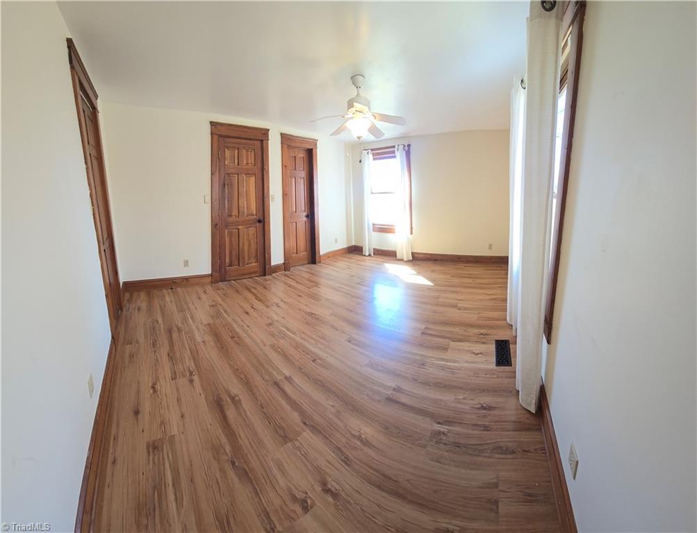 1077 Flat Shoals Road King, NC 27021 - Photo 21 of 46 A spacious bedroom wth 2 closets and lots of light.