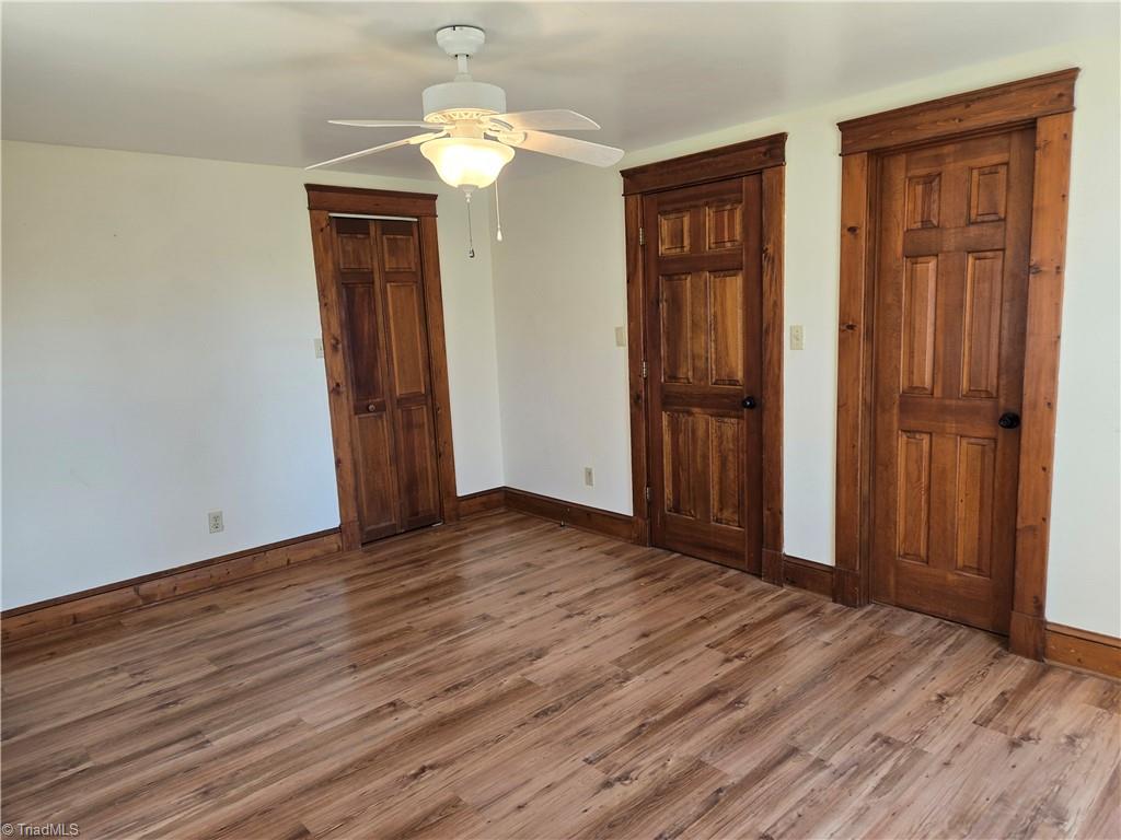1077 Flat Shoals Road King, NC 27021 - Photo 22 of 46 Walk in closet is the door on the left. To the hallway in the center and another closet on the right.