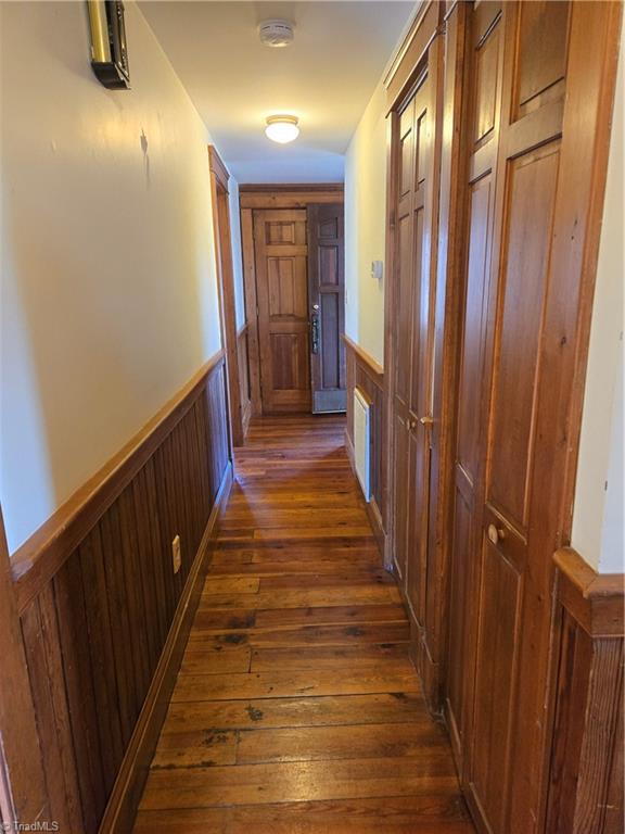 1077 Flat Shoals Road King, NC 27021 - Photo 25 of 46 Hallway continues to the second bedroom on this floor. Plenty of closet space on the right. Doors are all solid wood - no hollow core here.