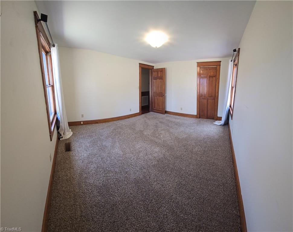 1077 Flat Shoals Road King, NC 27021 - Photo 26 of 46 Panorama view of bedroom with closet.