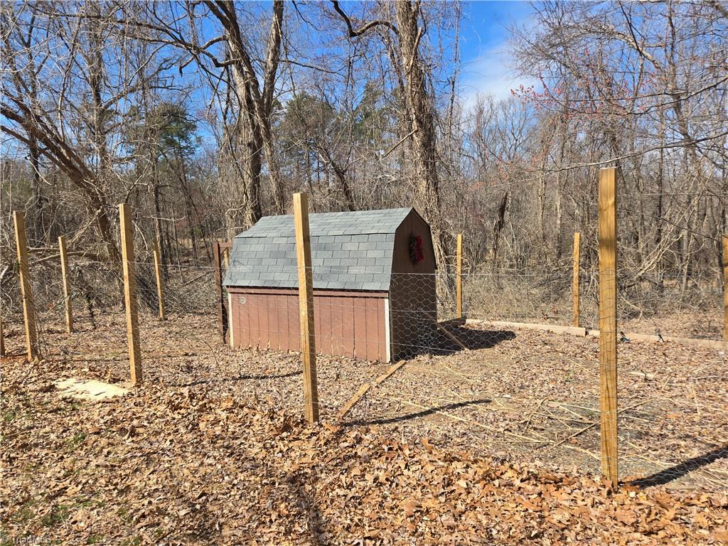 1077 Flat Shoals Road King, NC 27021 - Photo 42 of 46 Deluxe chicken house and fencing.