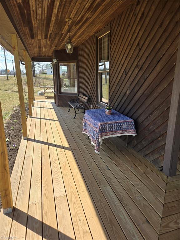 1077 Flat Shoals Road King, NC 27021 - Photo 7 of 46 Continues to open deck that is accessible from the kitchen through slidiing glass doors.