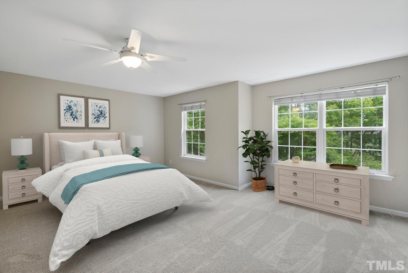 3011 Barrymore Street, Unit 107 Raleigh, NC 27603 - Photo 16 of 33 a spacious bedroom with a bed and a large window