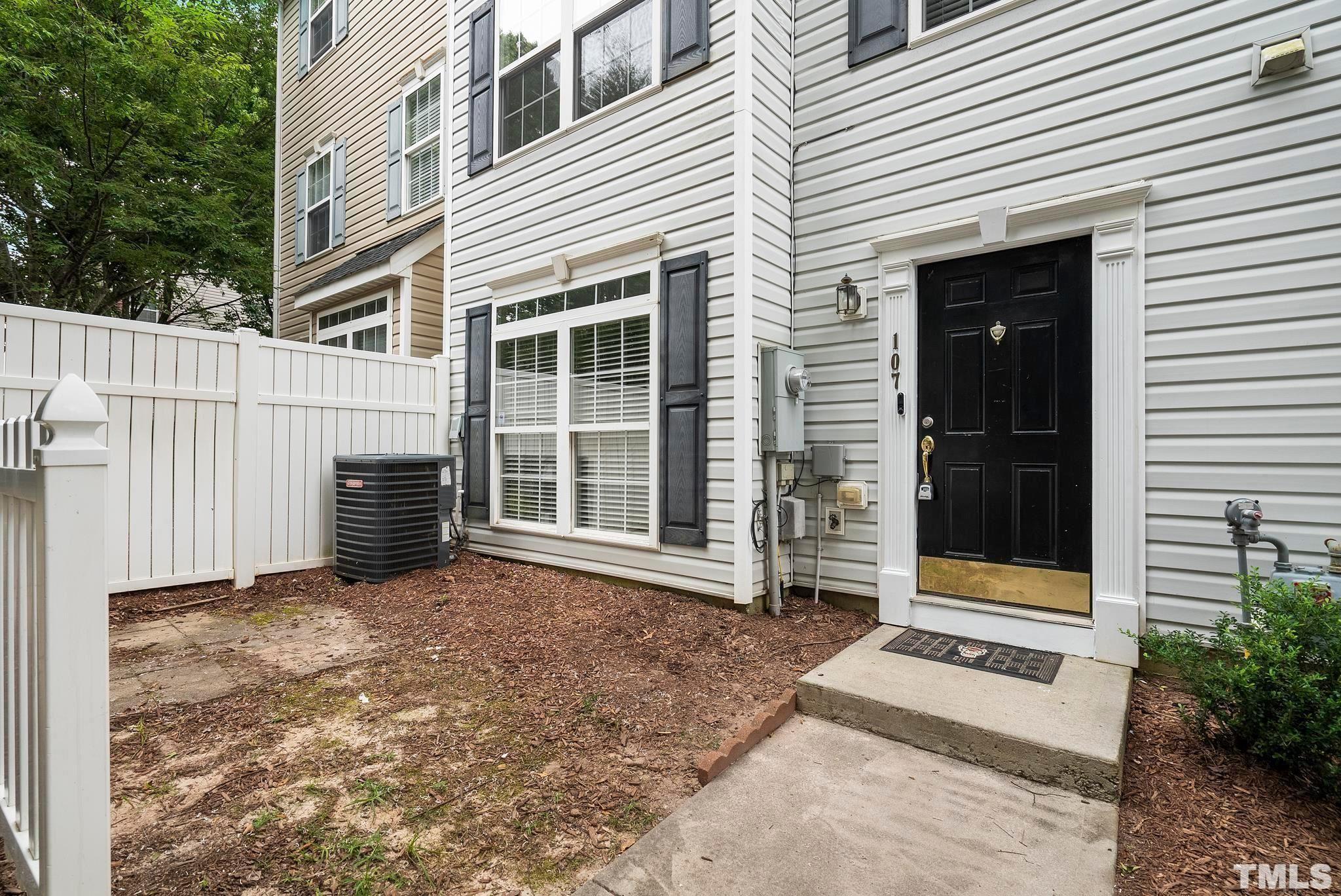 3011 Barrymore Street, Unit 107 Raleigh, NC 27603 - Photo 2 of 33 a view of a house with a large window and yard