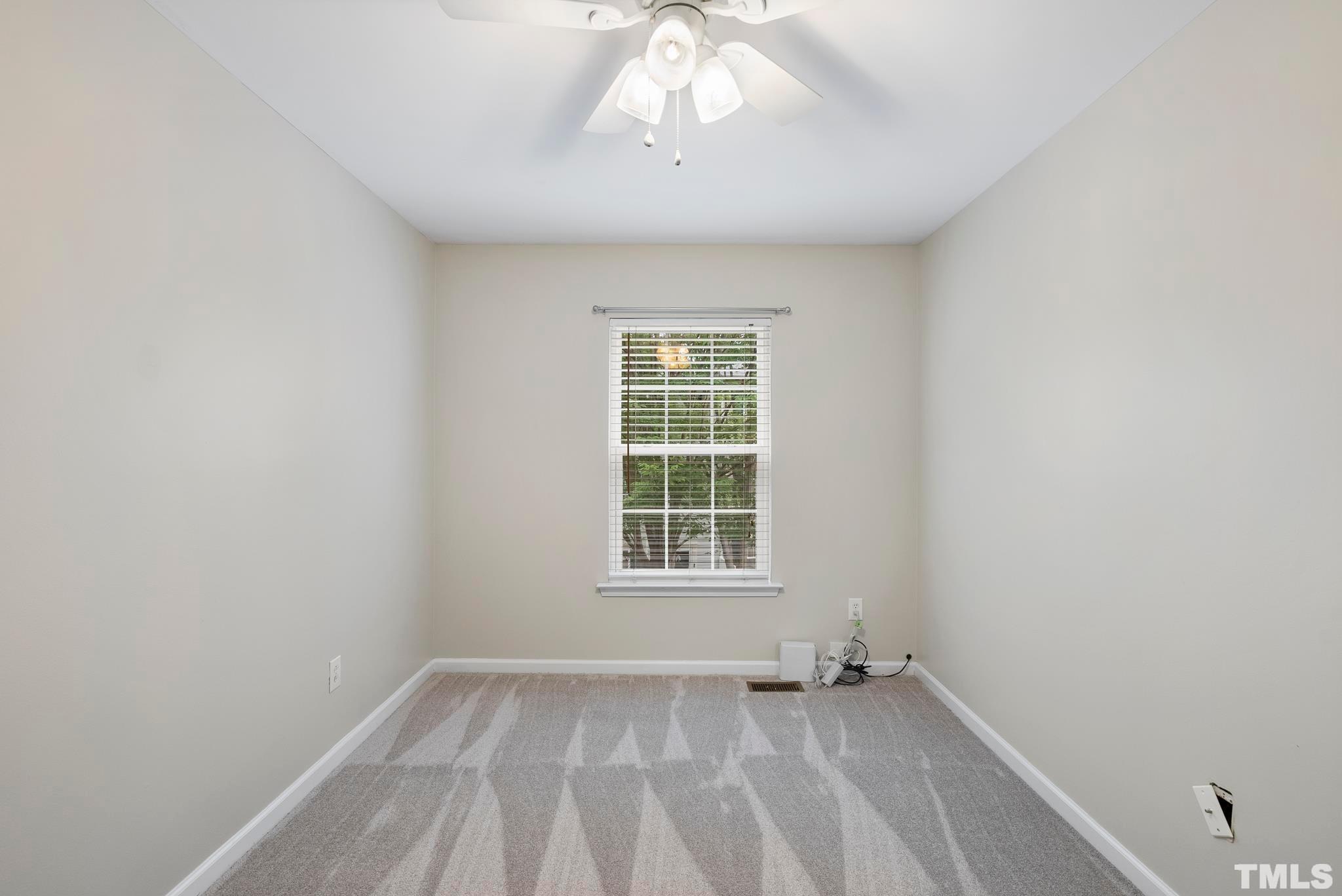 3011 Barrymore Street, Unit 107 Raleigh, NC 27603 - Photo 25 of 33 an empty room with a window