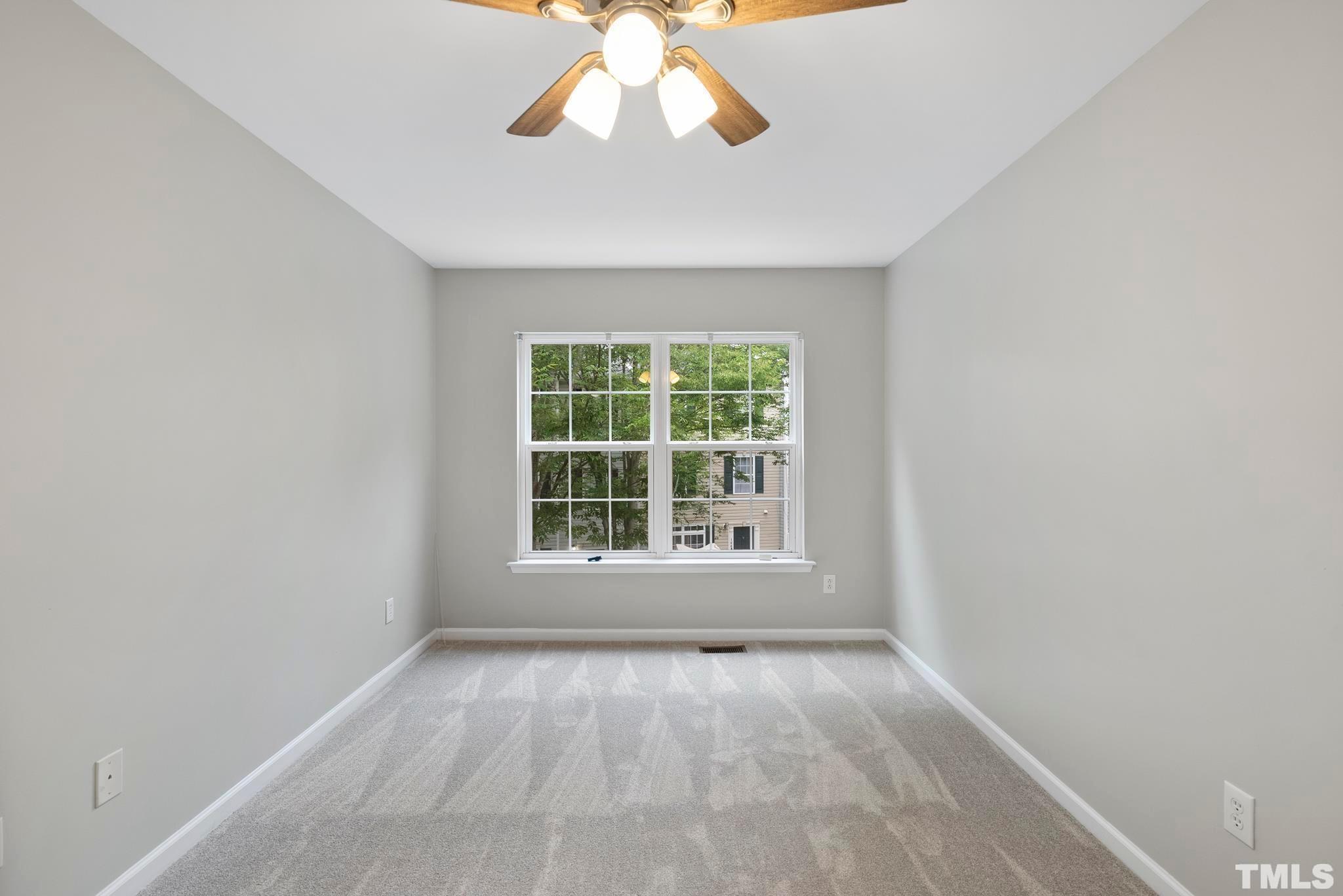 3011 Barrymore Street, Unit 107 Raleigh, NC 27603 - Photo 30 of 33 an empty room with a window