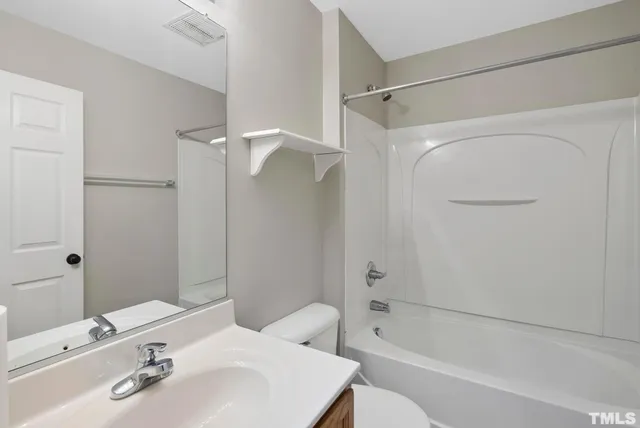 a bathroom with a sink and shower