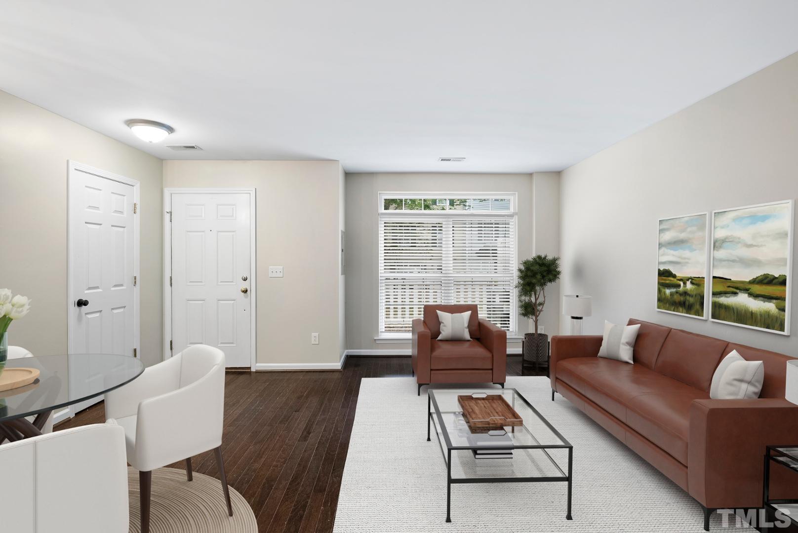3011 Barrymore Street, Unit 107 Raleigh, NC 27603 - Photo 7 of 33 a living room with furniture and a large window