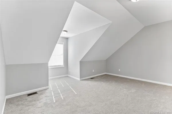 a view of an empty room with stairs