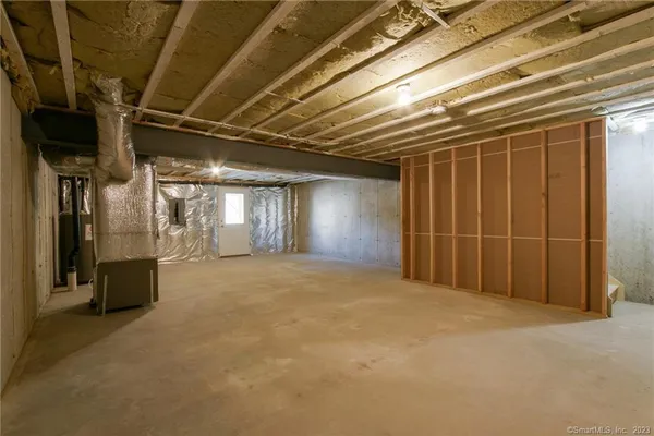 a view of an empty room with closet