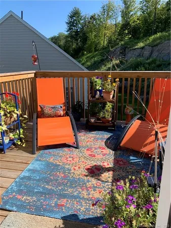 a view of a backyard with sitting area
