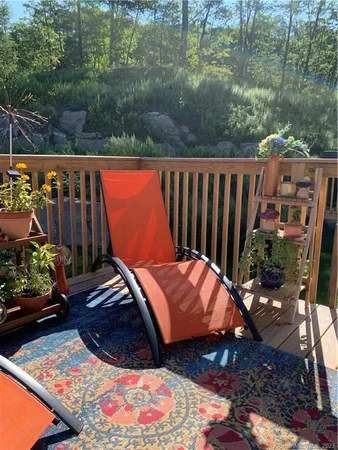 a view of a balcony with wooden floor