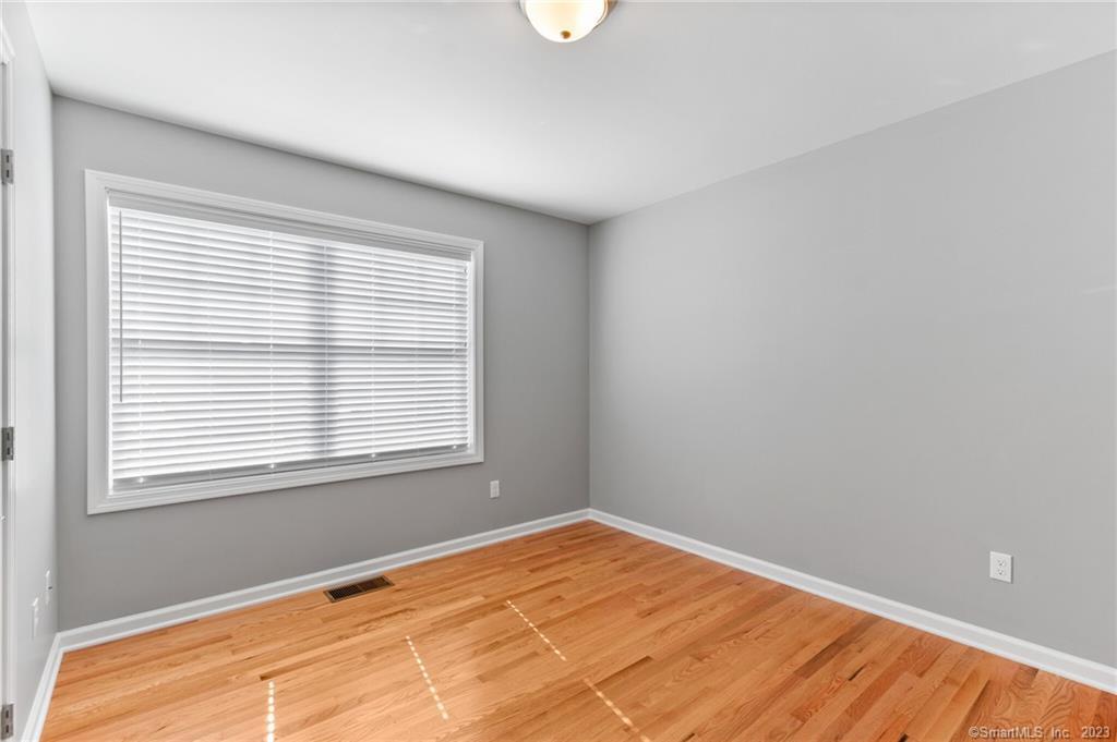 Four Twenty Four Bumper Road Harwinton, CT 06791 - Photo 10 of 28 a view of an empty room with wooden floor and a window