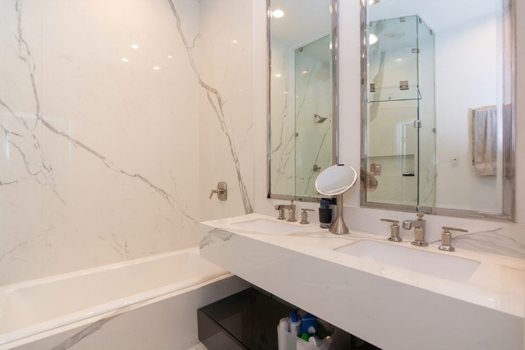 288 Commonwealth Avenue, Unit 1 Boston, MA 02115 - Photo 18 of 36 a bathroom with a bathtub and a sink