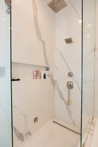 a bathroom with a tub and a shower