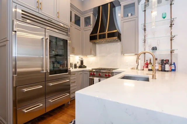 a kitchen with a refrigerator and sink