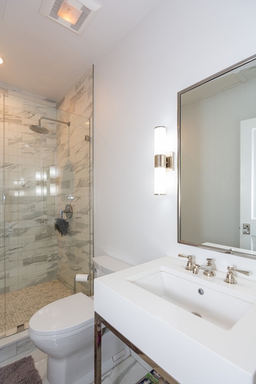 288 Commonwealth Avenue, Unit 1 Boston, MA 02115 - Photo 24 of 36 a bathroom with a sink toilet and shower