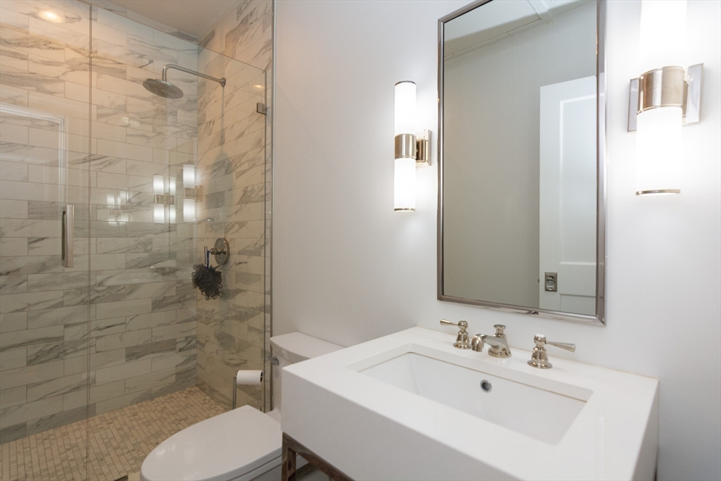 288 Commonwealth Avenue, Unit 1 Boston, MA 02115 - Photo 25 of 36 a bathroom with a sink toilet and shower