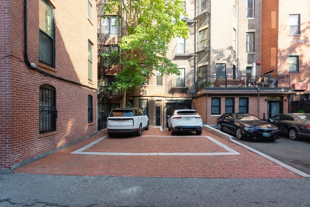 288 Commonwealth Avenue, Unit 1 Boston, MA 02115 - Photo 29 of 36 a car parked on the side of a street