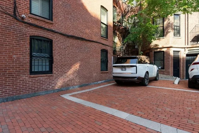 a view of a car park in front of house