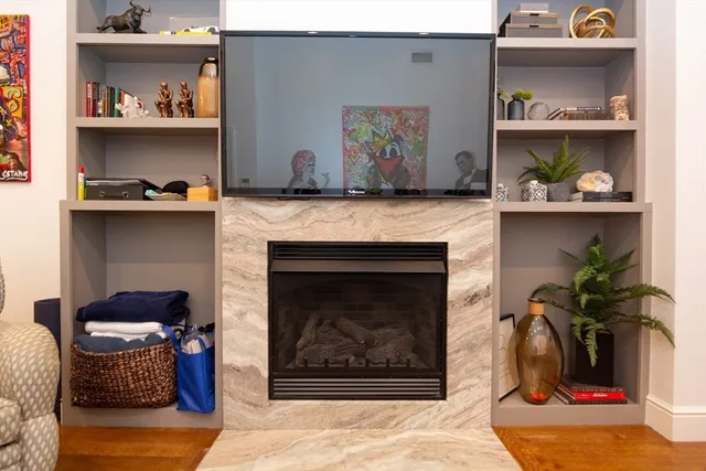 a living room with furniture and a fireplace