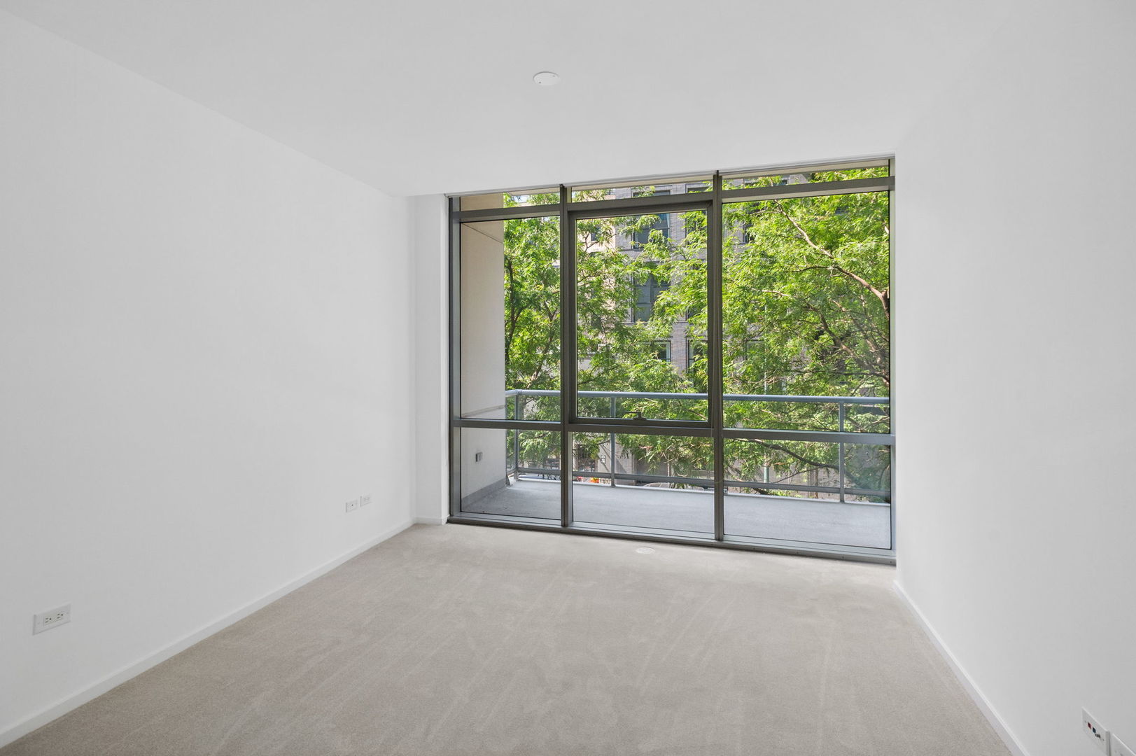 125 South Green Street, Unit 209A Chicago, IL 60607 - Photo 8 of 16 a view of a room with sliding glass door