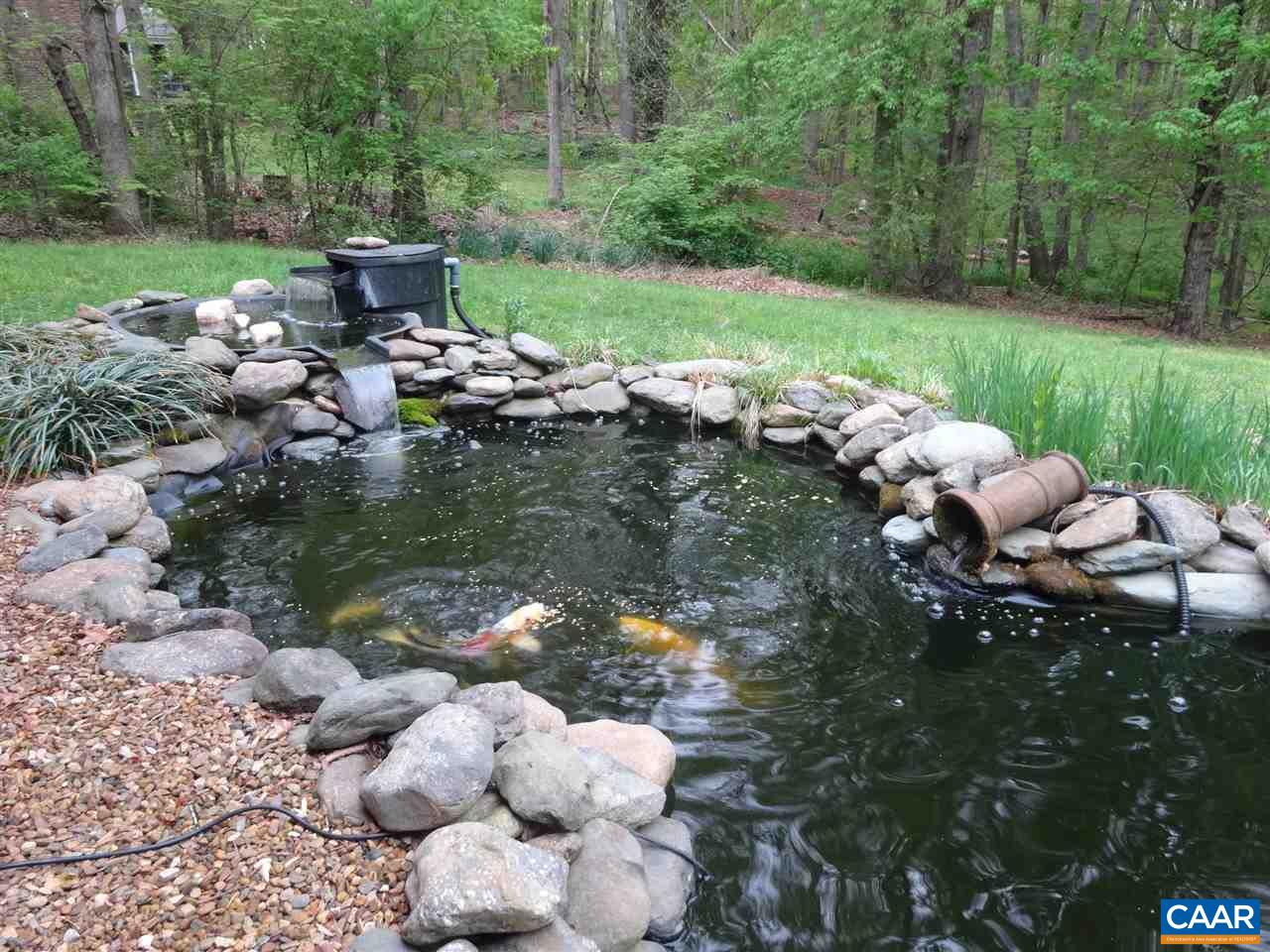 654 Miller School Road Charlottesville, VA 22903 - Photo 21 of 22 a backyard of a house with lots of green space