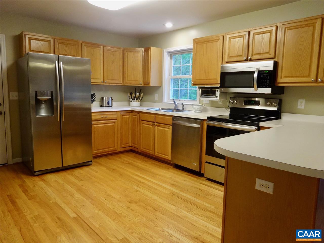 654 Miller School Road Charlottesville, VA 22903 - Photo 5 of 22 a kitchen with stainless steel appliances granite countertop a refrigerator a stove top oven a sink and dishwasher