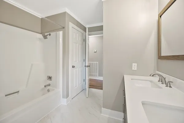 a bathroom with a glass shower door