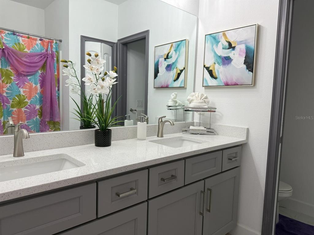 2050 Florida Development Road, Unit A Davenport, FL 33837 - Photo 11 of 17 a bathroom with a sink and a mirror