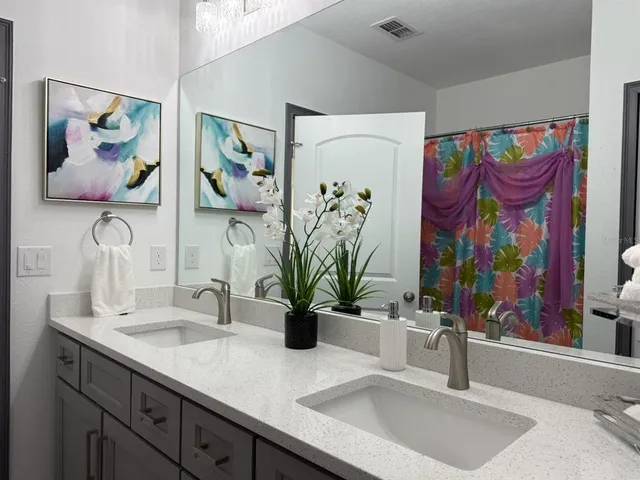 a bathroom with a sink a vanity and a mirror