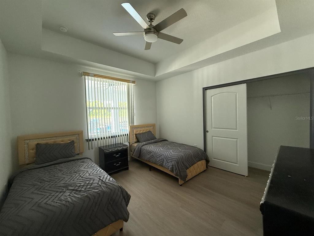 2050 Florida Development Road, Unit A Davenport, FL 33837 - Photo 13 of 17 a bedroom with two beds and window