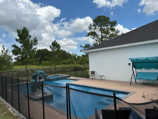a terrace with outdoor seating and lake view