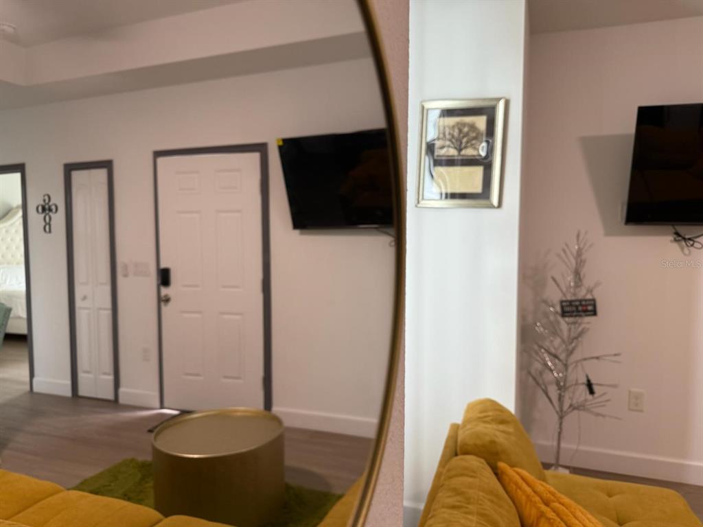 2050 Florida Development Road, Unit A Davenport, FL 33837 - Photo 6 of 17 a living room with furniture and a flat screen tv