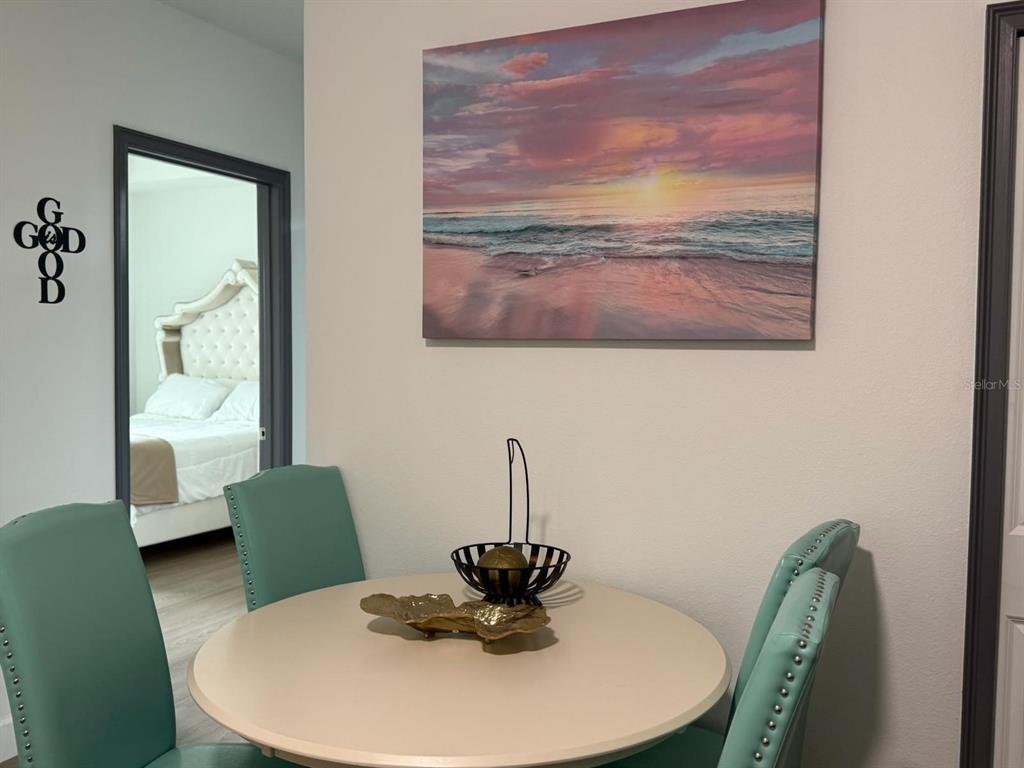 2050 Florida Development Road, Unit A Davenport, FL 33837 - Photo 7 of 17 a view of a dining room with furniture and wooden floor