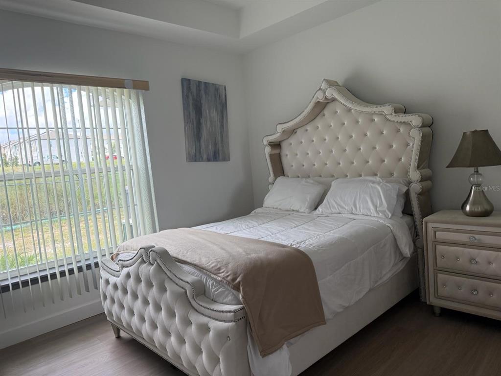 2050 Florida Development Road, Unit A Davenport, FL 33837 - Photo 8 of 17 a bedroom with a bed and a window