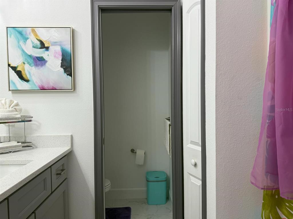 2050 Florida Development Road, Unit A Davenport, FL 33837 - Photo 10 of 17 a bathroom with a sink and a mirror