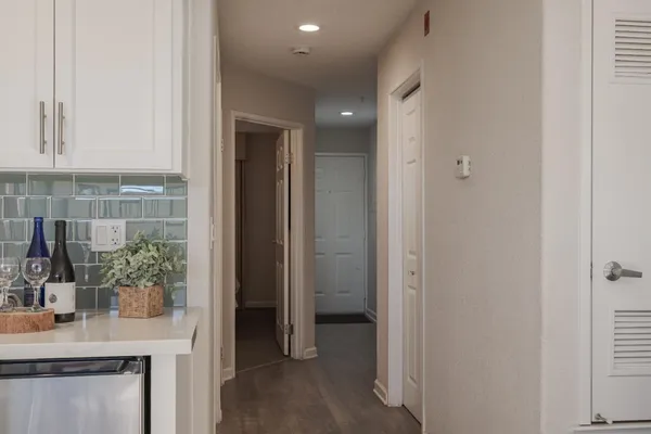 a view of hallway with sink and potted plant