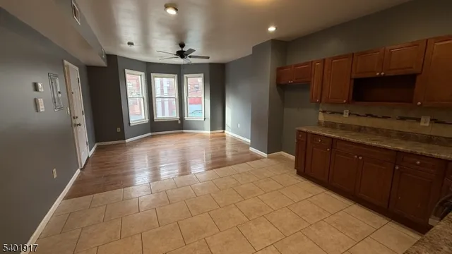 a kitchen with stainless steel appliances a sink stove and cabinets