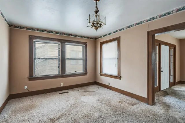 a view of an empty room with a window